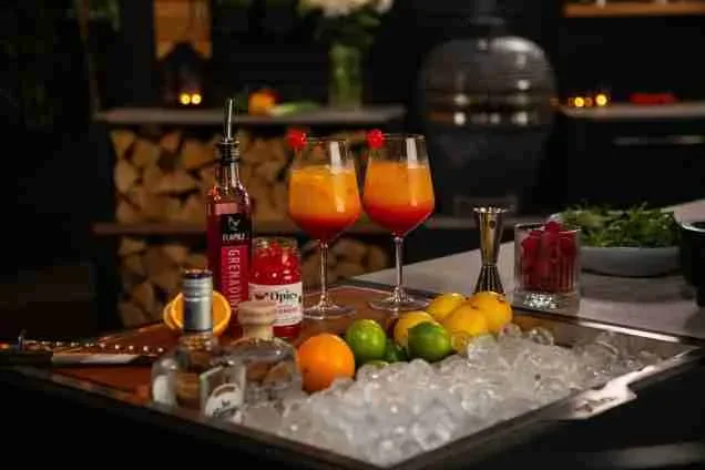 Grillo Drinks Station with cocktails on rosemary wood chopping board