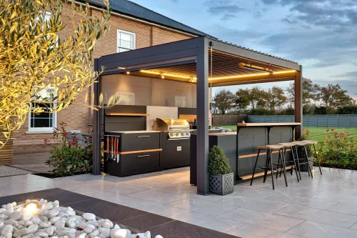 Outdoor kitchen in horkesley heath colchester on patio under pergola with custom lighting