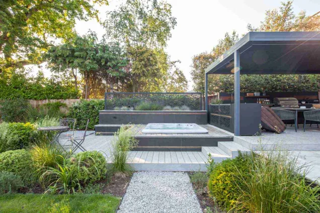 Outdoor kitchen in Stoke D'Abernon, Cobham garden under pergola with hot tub
