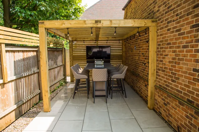 Outdoor kitchen in Ashby Leicestershire with dining area under cover