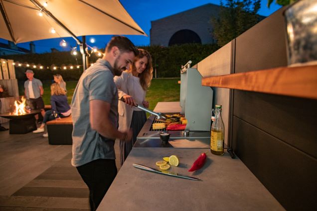 people preparing and cooking on grillo kitchen and Voltiq electric BBQ