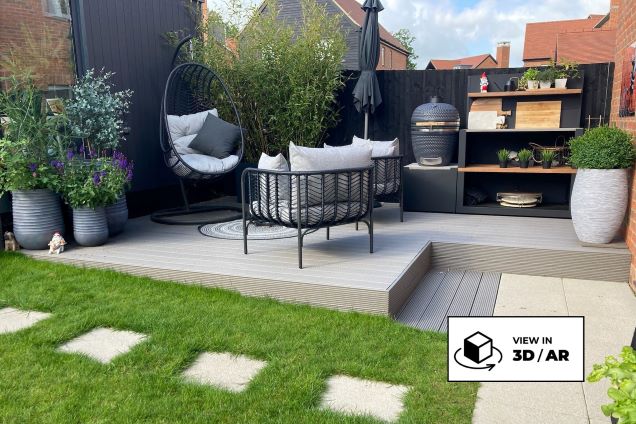 outdoor kitchen on decking with seating area and plants