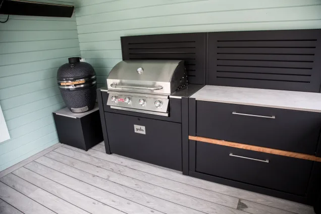 gas and charcoal BBQs in outdoor kitchen in Warwickshire