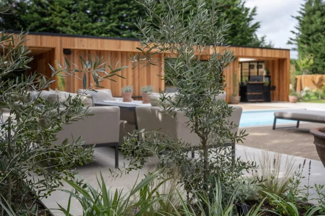 plants in front of seating area and outdoor garden building