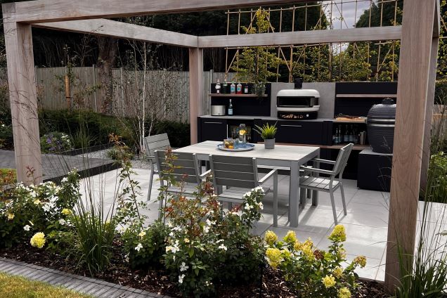 Outdoor kitchen in cadeby with gozney pizza oven and gusto bbq and outdoor table and chairs on patio