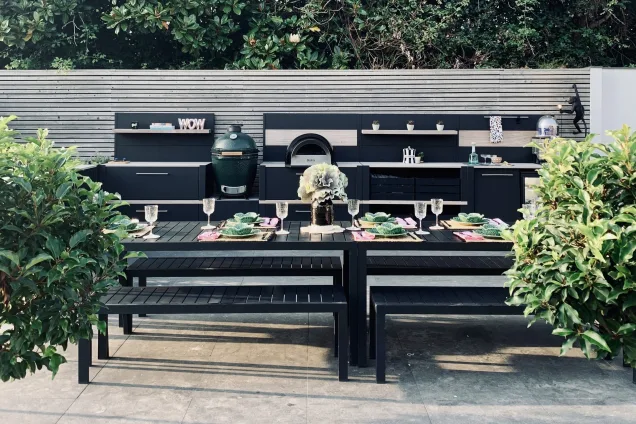 Outdoor kitchen in Bosham, Chichester with table set for a meal