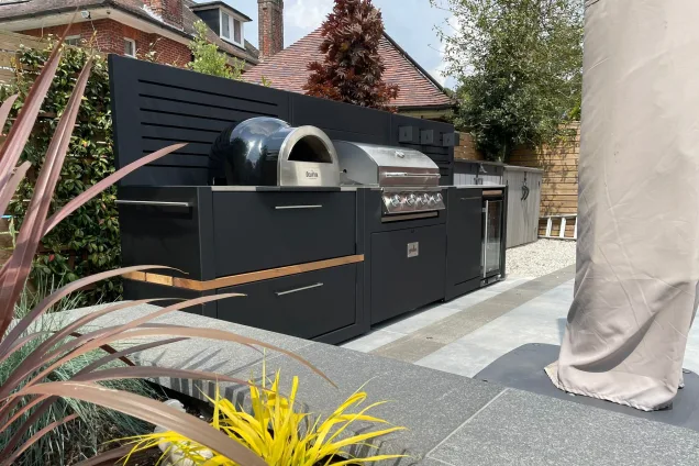 Outdoor kitchen in Bournemouth, Dorset on patio with folded parasol