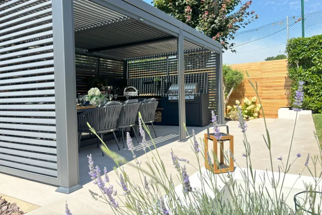 Outdoor kitchen in Burwell, Cambridge with Pizza oven and gas bbq under pergola