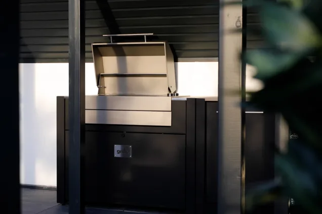 Outdoor kitchen in Birmingham with Voltiq bbq with lid open