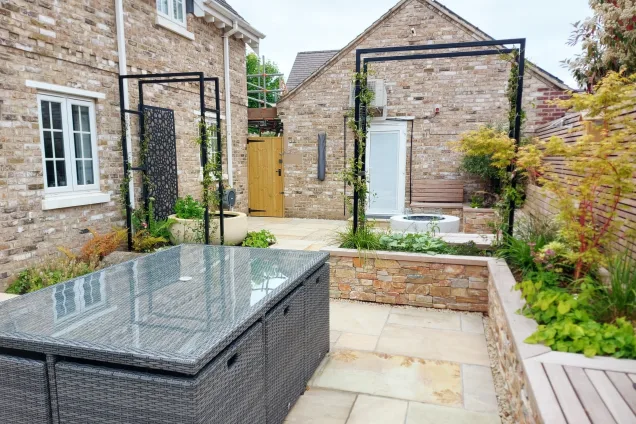 courtyard with dining table , water fountains and planters in Mountsorrel, Leicestershire
