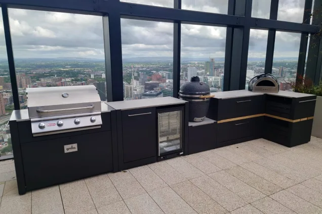 Outdoor kitchen in Manchester with pizza oven, gas bbq