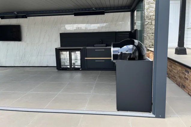 pizza oven and built-in fridge in outdoor kitchen under roof in Maidstone, Kent