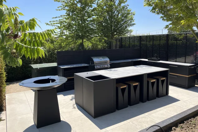 L-shaped outdoor kitchen with bar island and hotplate BBQ in Little Waltham, Chelmsford, Essex