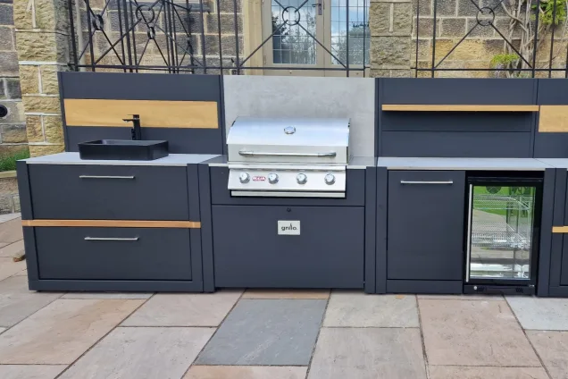 Outdoor kitchen in Ilkley, Yorkshire with bull bbq, pizza oven, fridge and sink