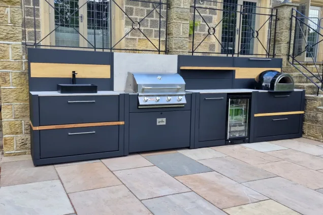 Outdoor kitchen in Ilkley, Yorkshire with bull bbq and pizza oven on patio