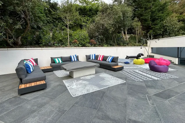 Outdoor kitchen in Farnham on patio with outdoor seating area