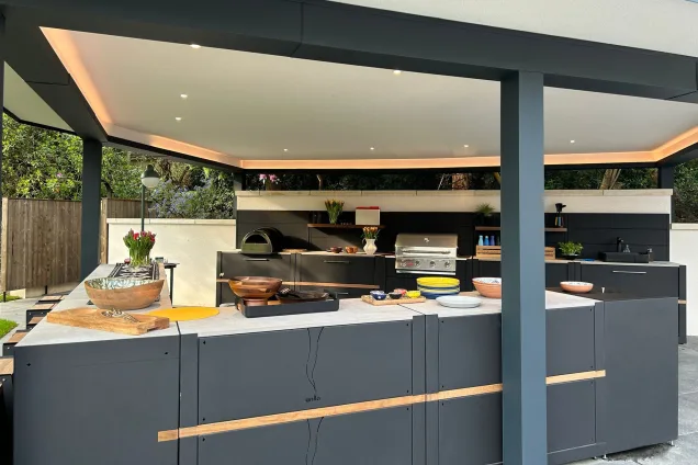 Outdoor kitchen under pergola in Farnham with bull gas bbq