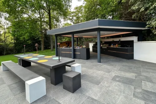 Outdoor kitchen under pergola in Farnham with wood fired pizza oven and bull gas bbq