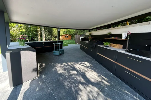 Outdoor kitchen under pergola in Farnham with wood fired pizza oven and gas bbq