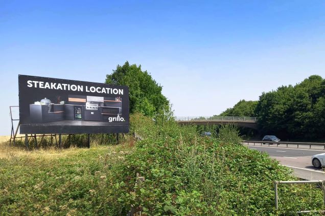Grillo kitchen billboard saying stakeation location