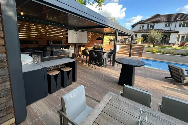 outdoor kitchen in manchester next to an outdoor pool