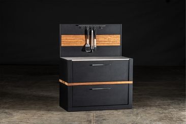 Outdoor kitchen storage module with feature wall