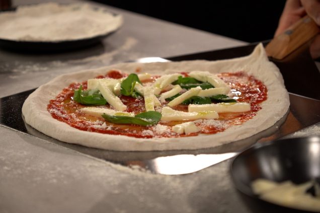 pizza on pizza peel ready to be cooked