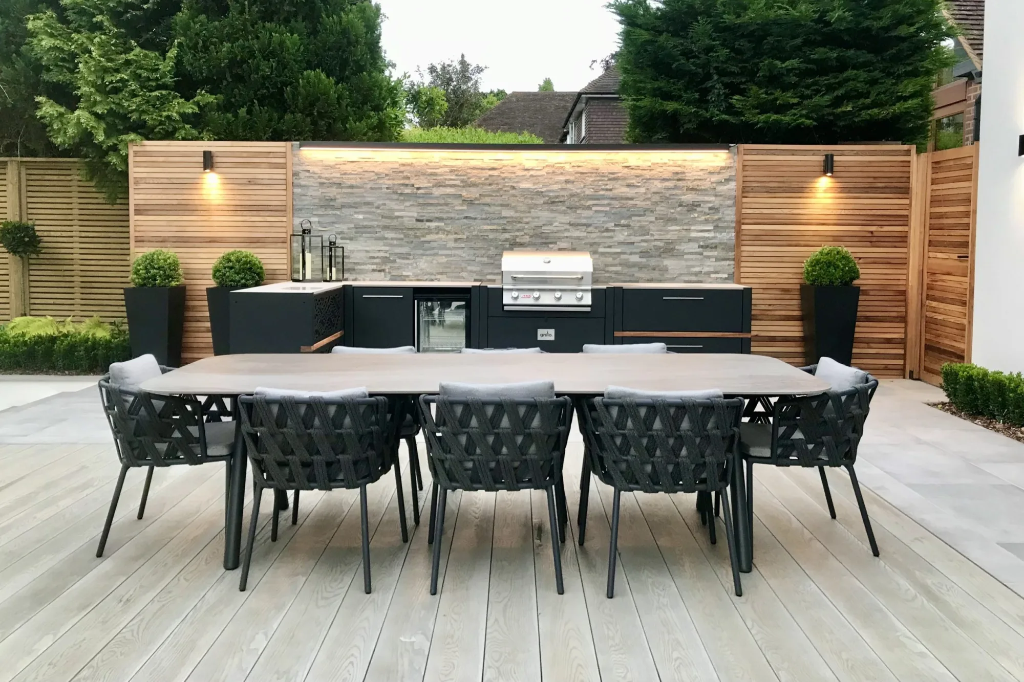 outdoor kitchen in kent on decking with large outdoor table