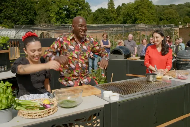 Ainsley and chefs at grillo kitchen on ITV show