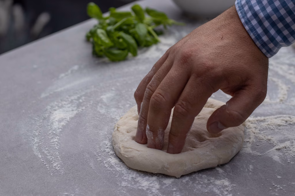 moulding dough on worktop