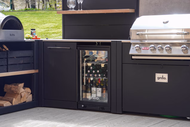 Grillo kitchen showroom with fridge and bin, gas bbq and pizza oven