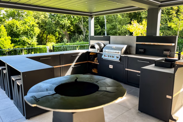 Outdoor kitchen in Runnymede, Surrey with large u shaped outdoor kitchen