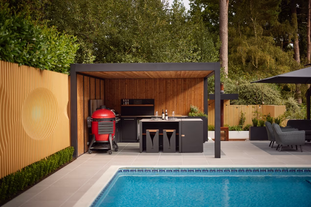 Thumbnail of an outdoor kitchen in a garden near Ashtead, Surrey, with a forest in the background
