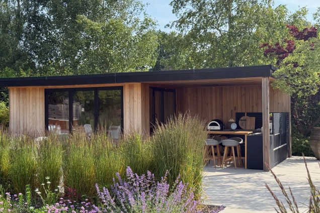 garden studio with outdoor kitchen under canopy