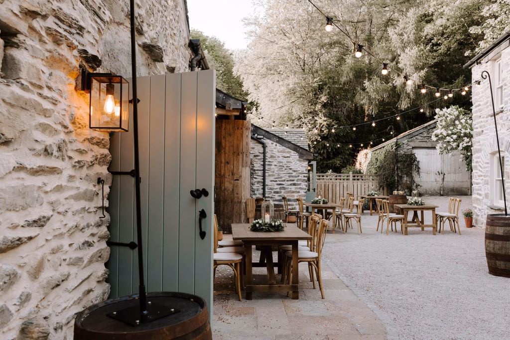town head estate wedding barn with tables and chairs outside