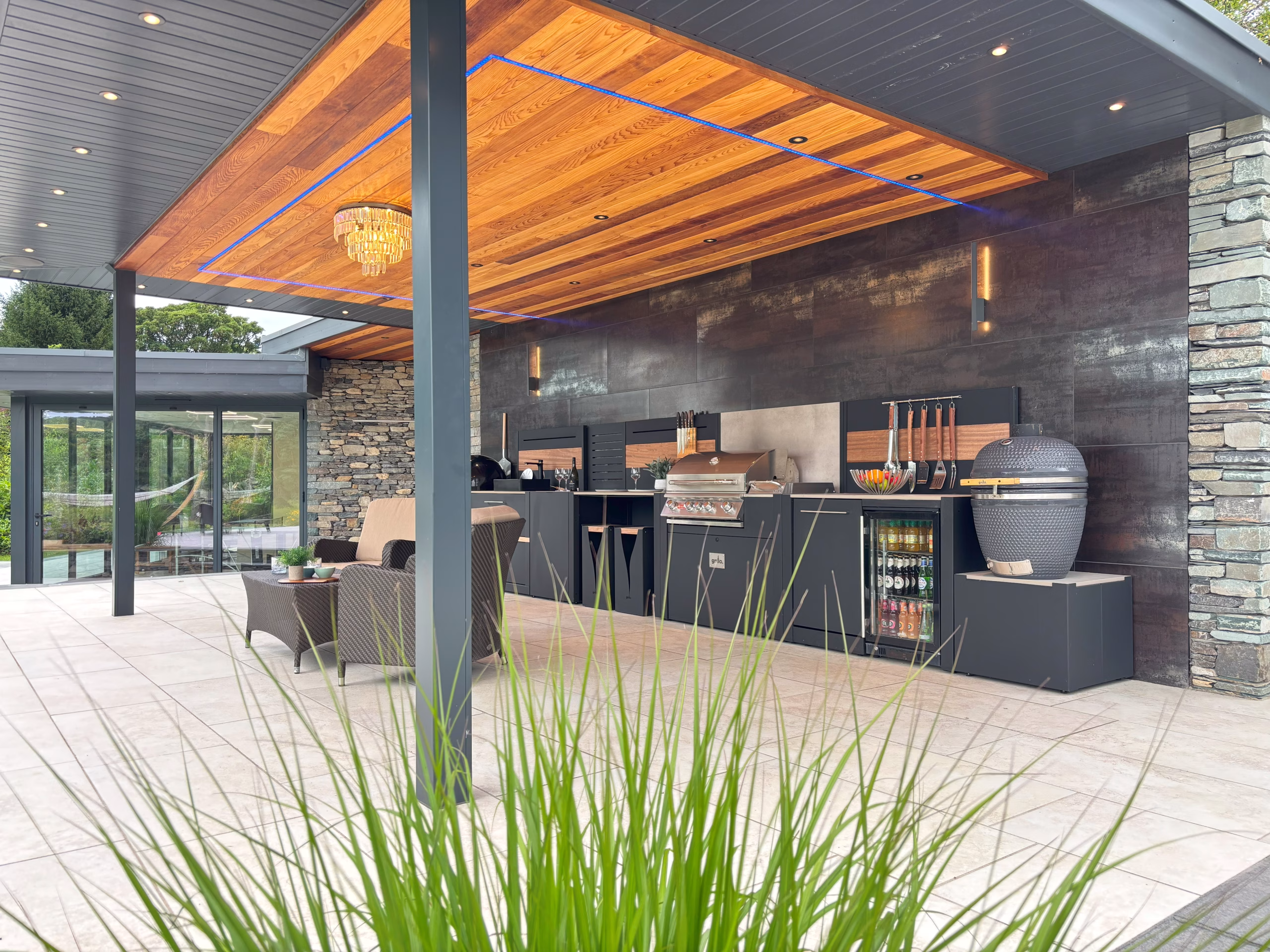 grillo outdoor kitchen under cover with seating area in front of it