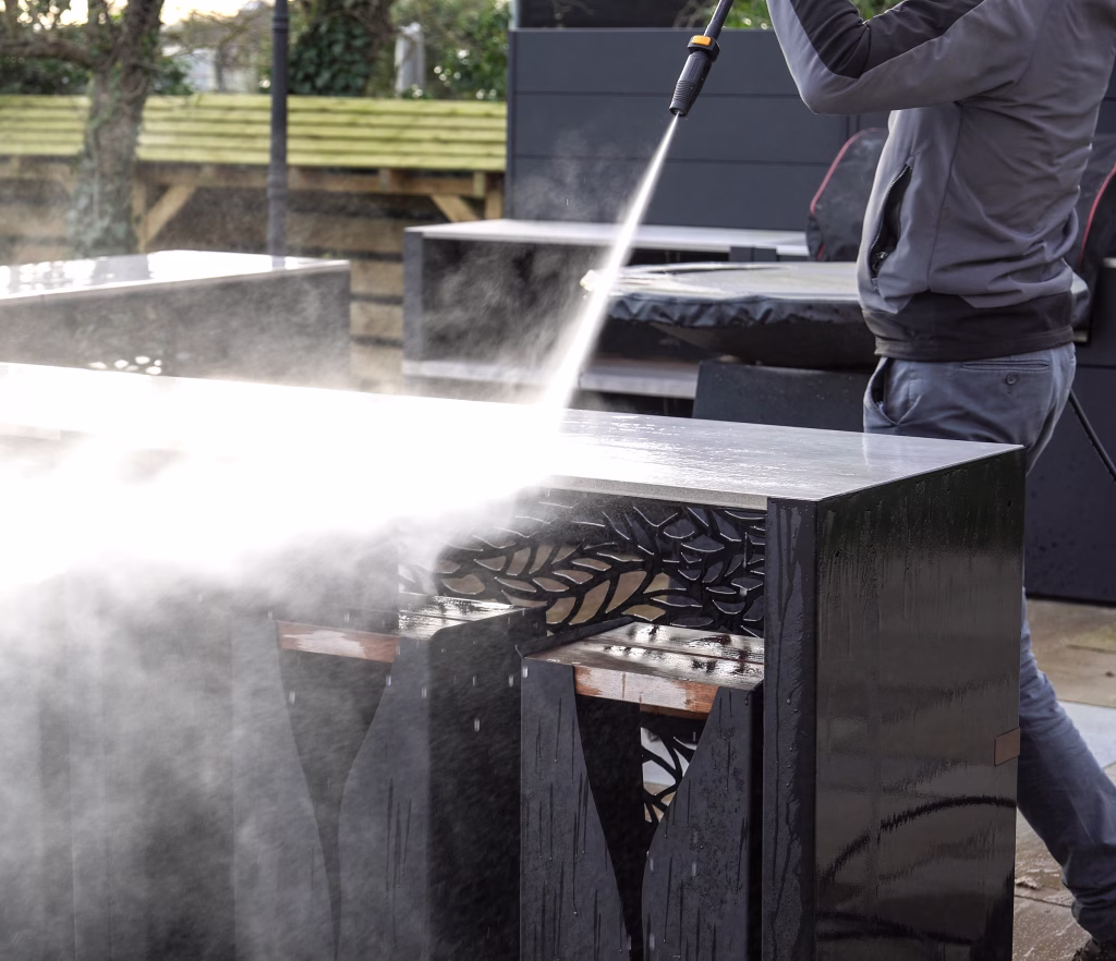 A Grillo Vantage outdoor kitchen bar being pressure washed for easy cleaning