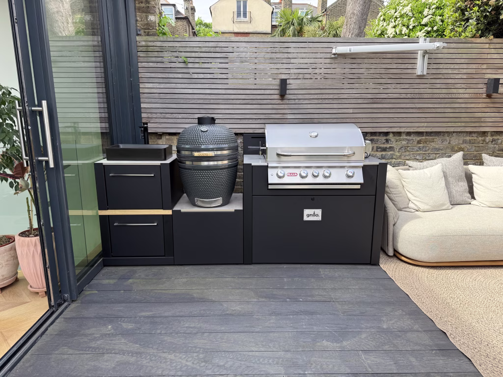 outdoor kitchen on patio with sink, gusto charcoal bbq and gas grill station