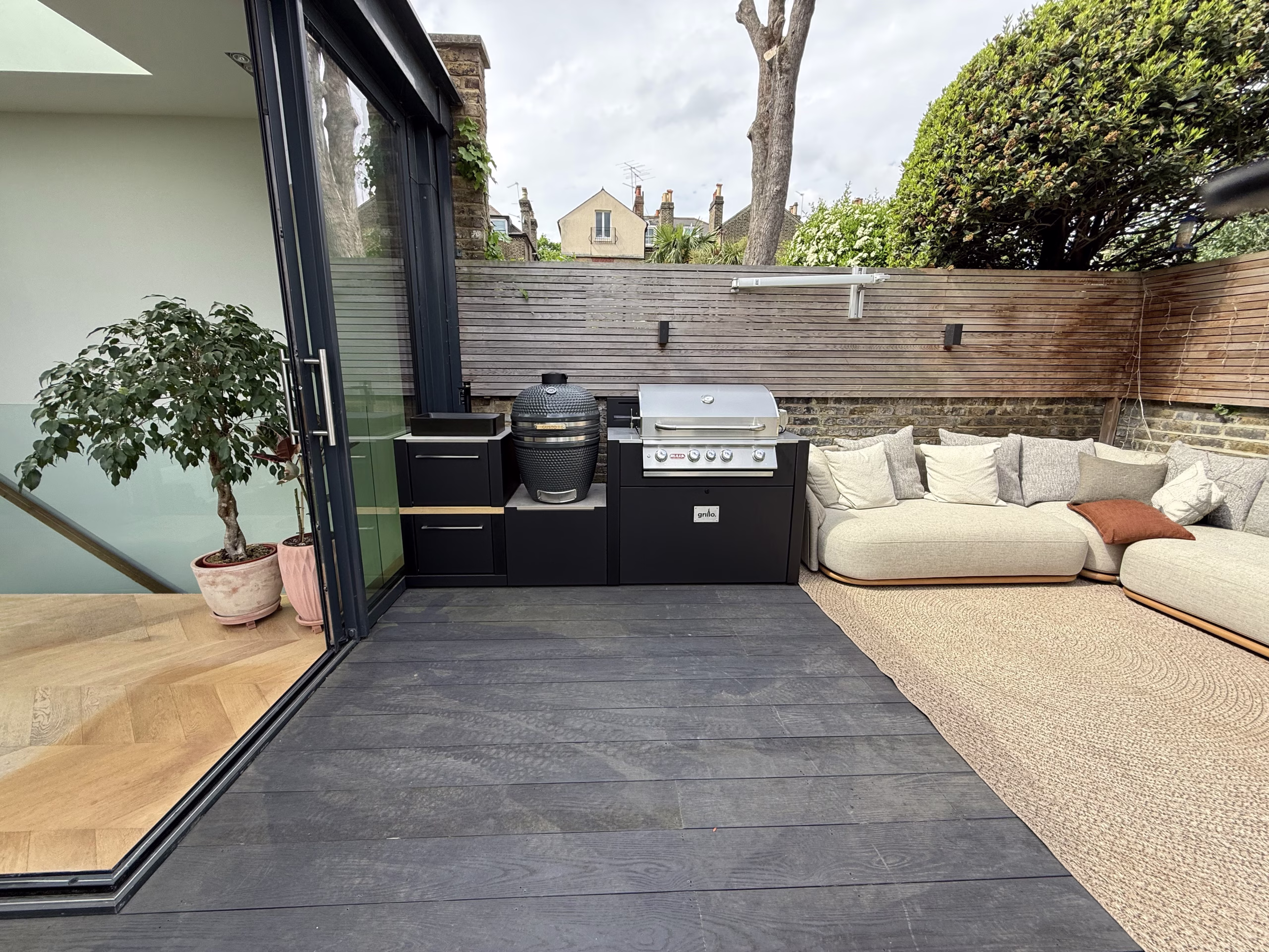 outdoor kitchen on patio with gas and charcoal bbqs