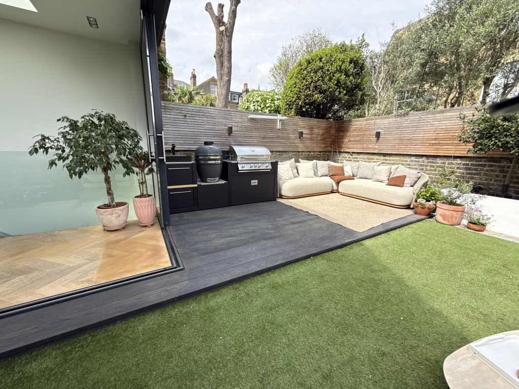 outdoor kitchen in landscaped garden on patio
