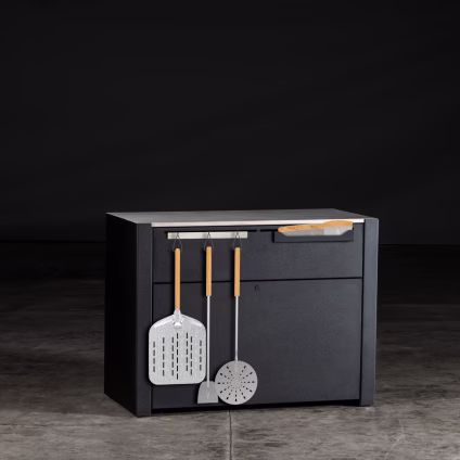 element pizza oven station with tools hanging on front in studio